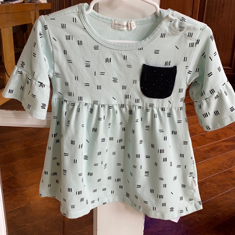 Mint dress with black design. Size 12 months.